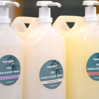 CBD hand and body wash refillery pump action containers lined up on a shelf
