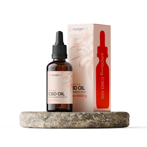 CBD oil bottle and packaging on a white background