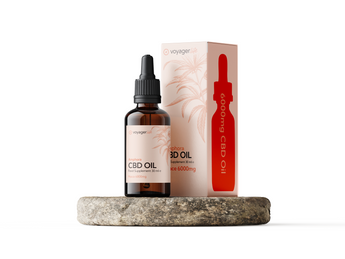 CBD oil bottle and packaging on a white background