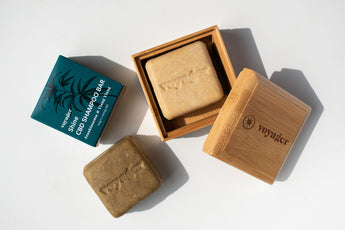 Two voyager life soap bars and a bamboo box with 'Voyager' branding on a white background