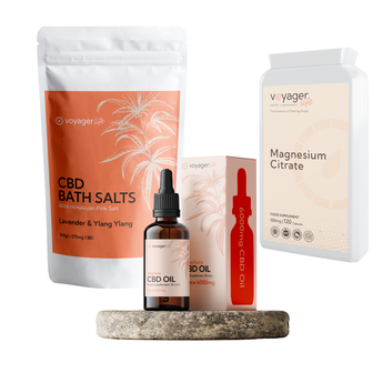 Collection of Voyager Life CBD products including bath salts, oil, and magnesium citrate on a white background.