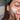 Woman applying antioxidant face cream, CBD moisturiser on her face