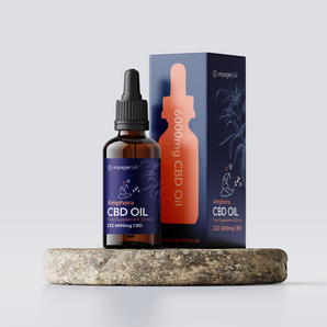 Voyager Lab ZZZ CBD oil in a bottle and packaging on a stone surface with a light gray background