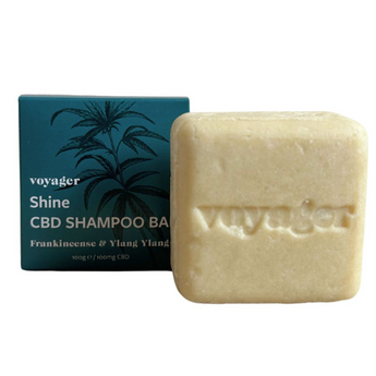 Voyager Shine CBD Shampoo Bar box with light shampoo piece on white background